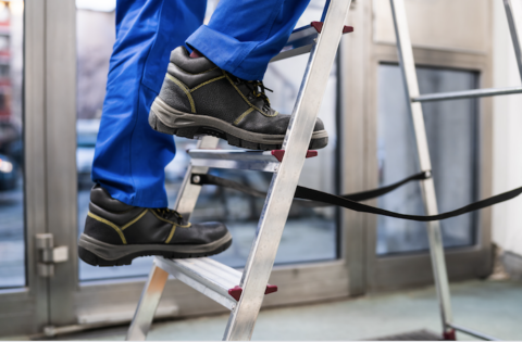 MEP technician on ladder